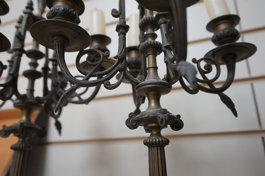 A pair of four branch candelabra raised on slate bases with paw feet, 62cm high. Condition - fair/good